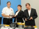 (L - R) Lisandro Rosales of COPECO, Nelly Patricia Gaekel of CONATEL, and Miguel Alcaine of ITU Area D, with some of the donated Amateur Radio equipment.